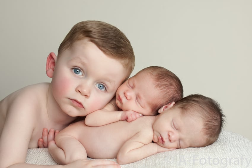 toddler and newborn twins during photography session
