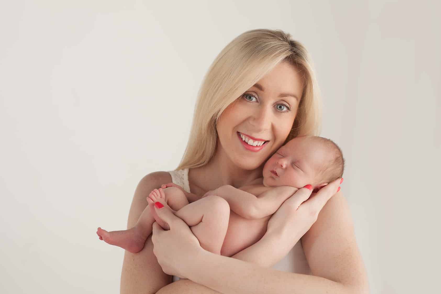 mum wearing a sleeveless top for the newborn photo shoot