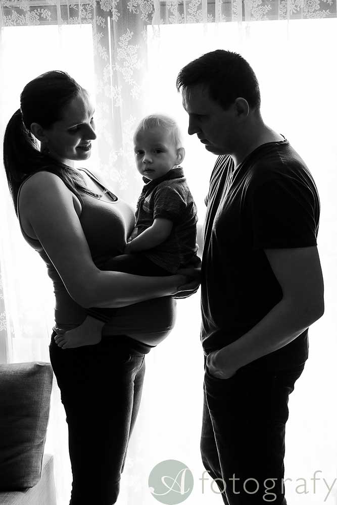 family maternity home photo shoot with silhouette effect
