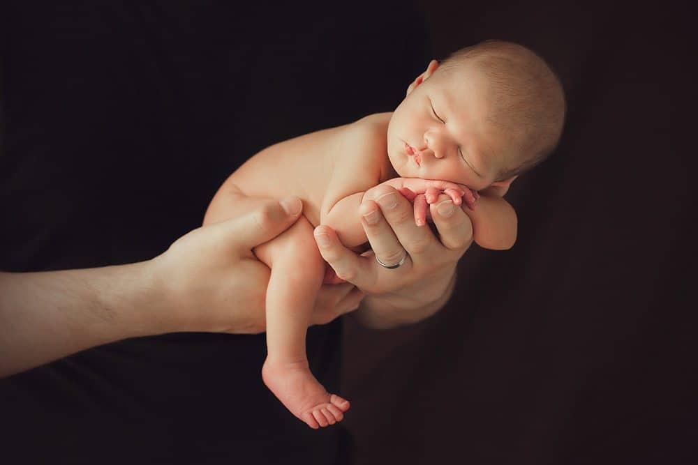 creative newborn photography poses for studio photo shoot