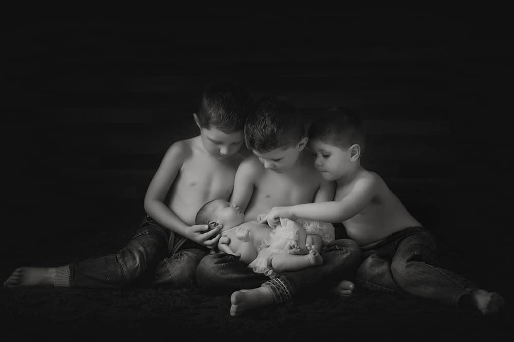 black and white portrait of newborn and siblings in Edinburgh studio