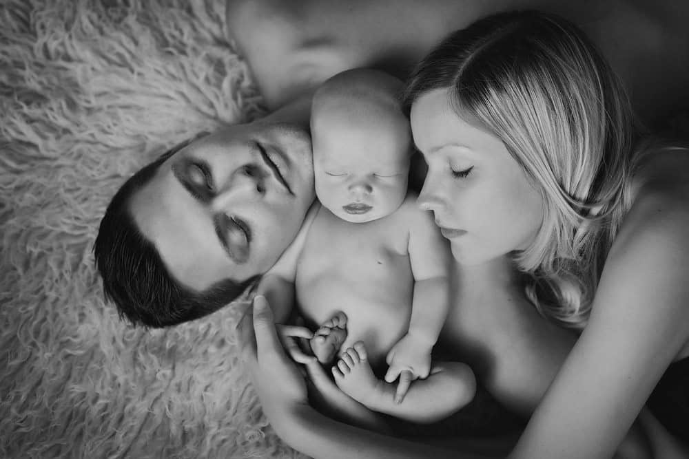 calm family portrait with newborn baby during photo session