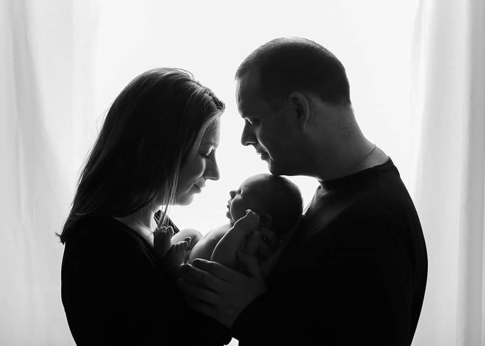 newborn baby with family during photo shoot in edinburgh