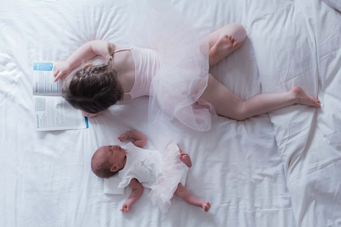 newborn photos taken at home. newborn and her sibling