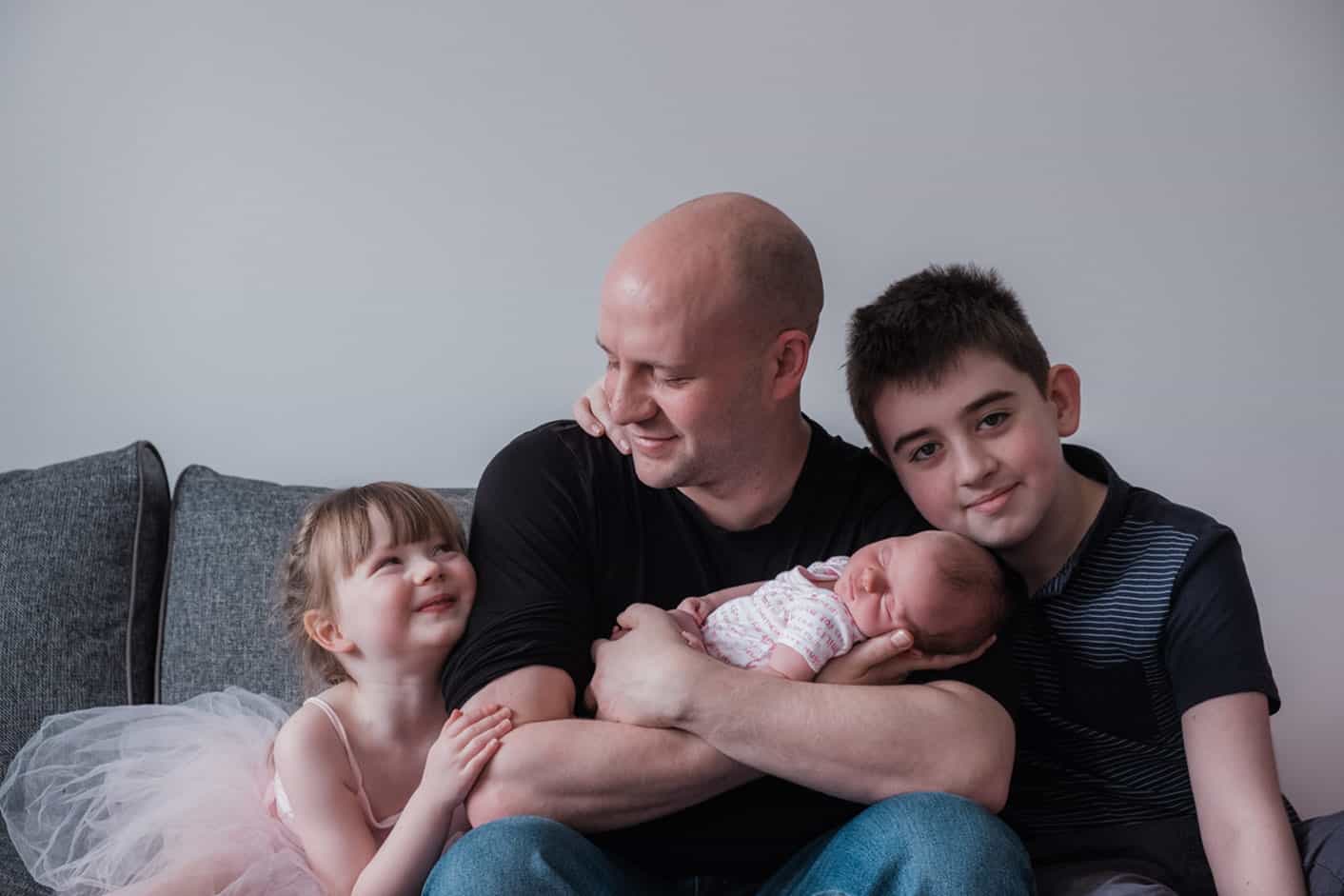 newborn family photo done with parents and kids