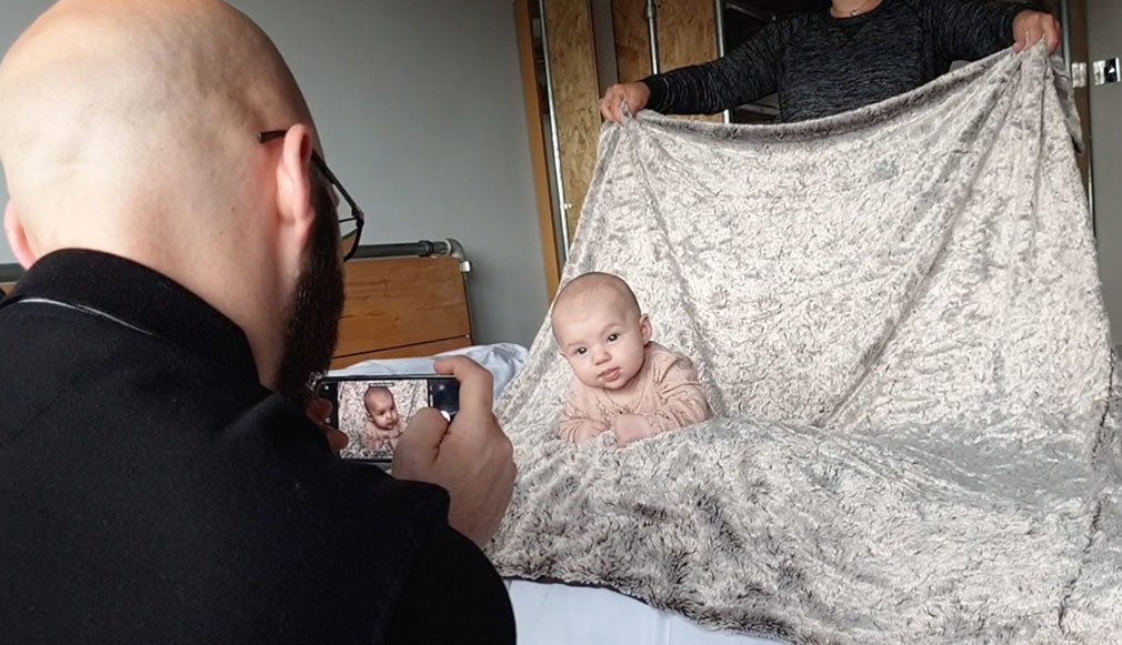 Diy newborn photos at home using phone.
