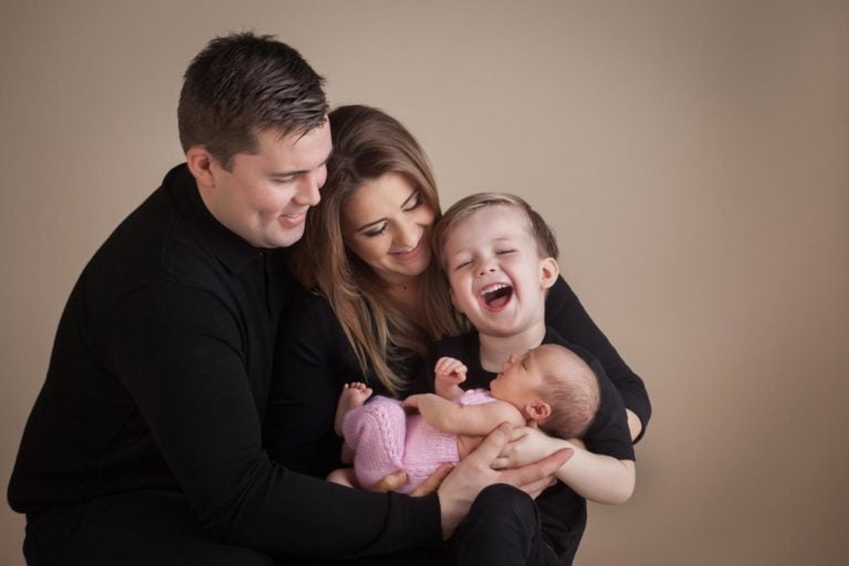 Newborn family photos with siblings and dogs. 8