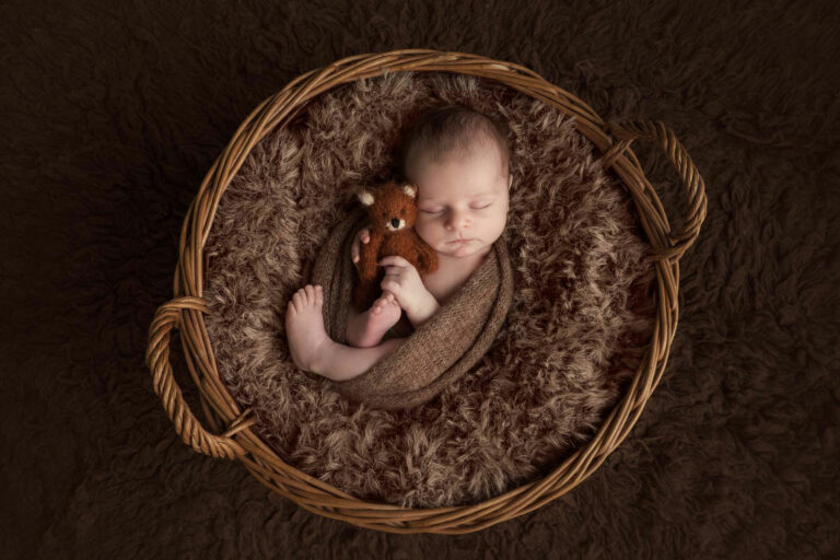 newborn photoshoot in edinburgh with baby holding teddy