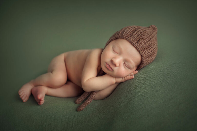 newborn photographer in edinburgh with baby on the side pose